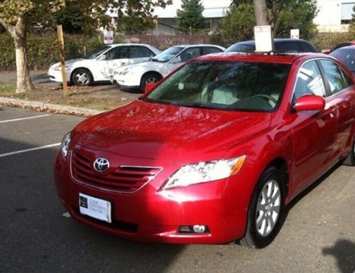 After: red sedan front-end collision repair