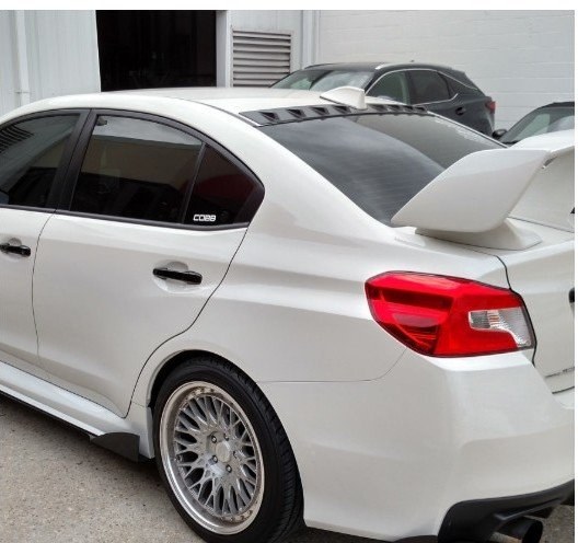 After: white sports sedan collision repair